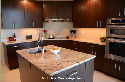 A kitchen with a granite countertop