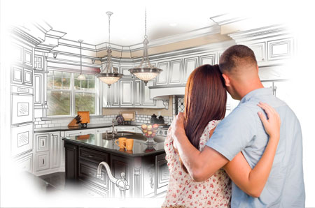 A couple is hugging in the kitchen of their new home.