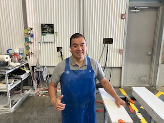 a man at work wearing apron
