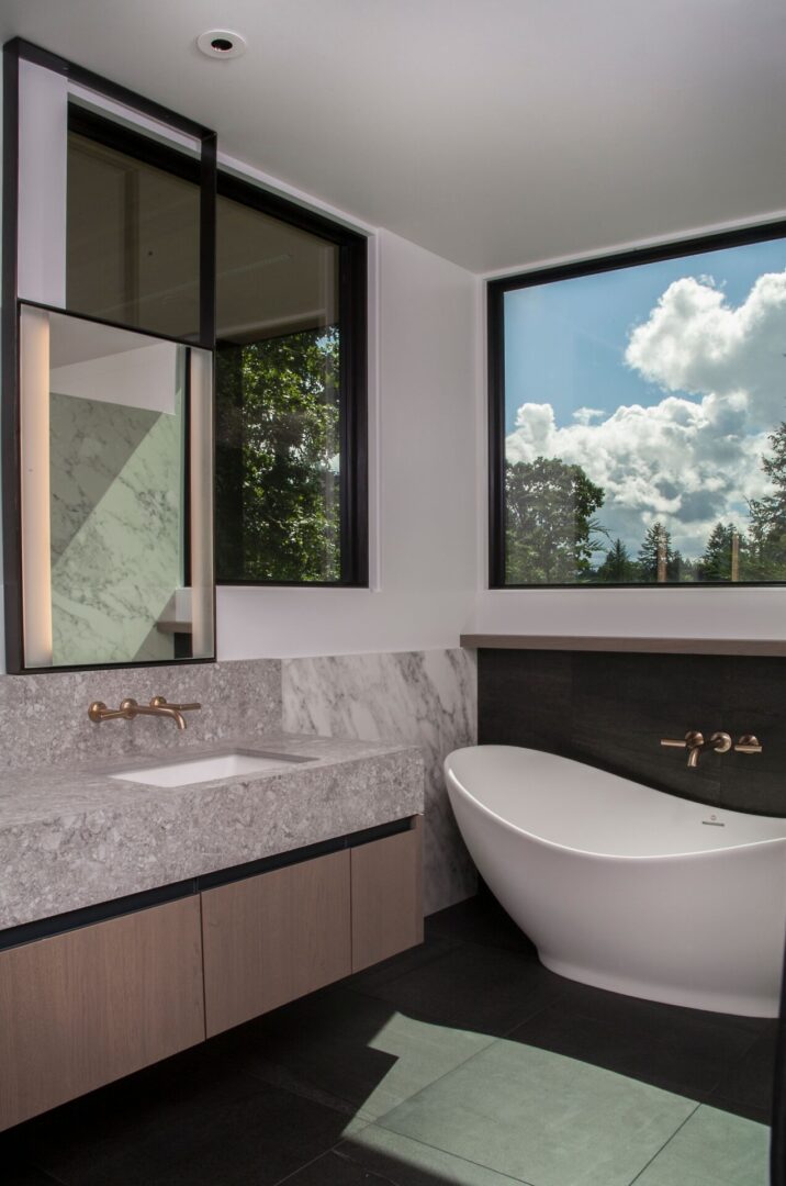 A bathroom with a large window and a toilet