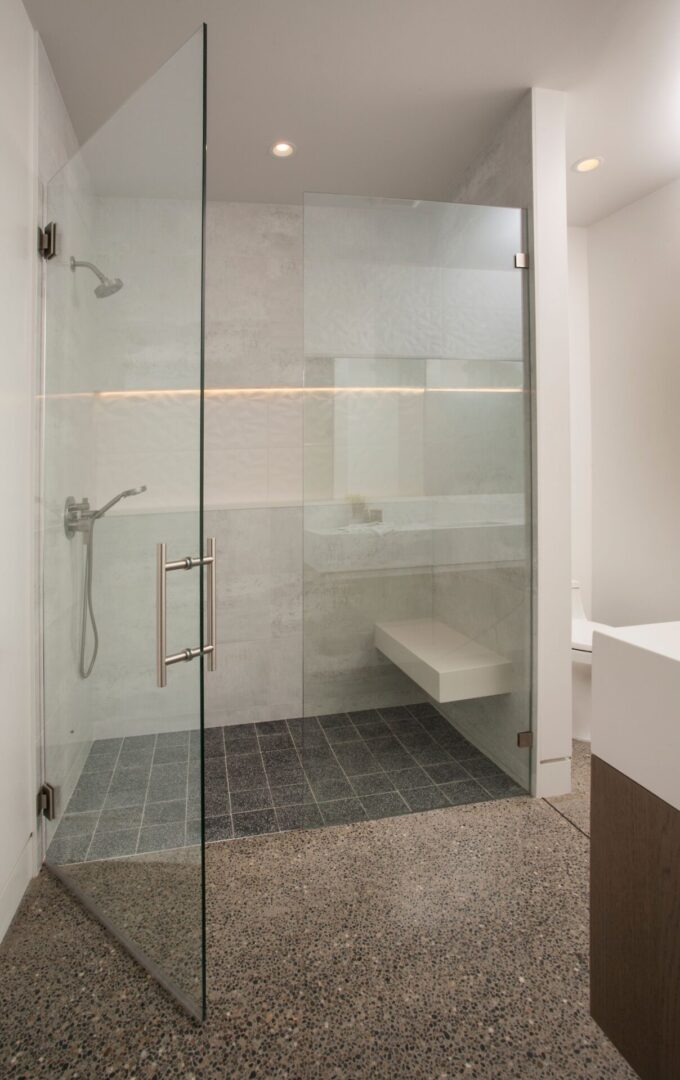 a shower area with glass doors